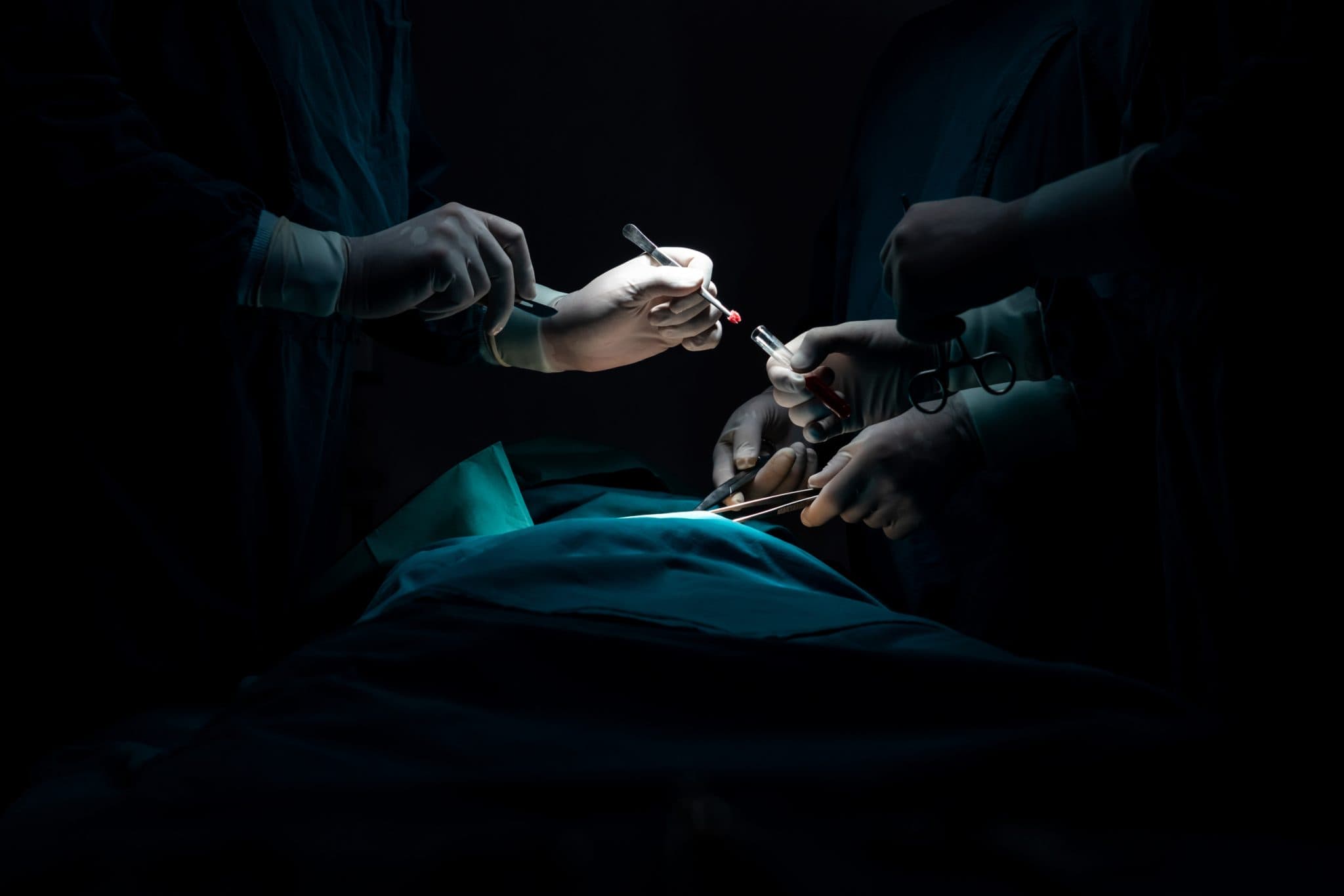 Military medics operating under low light